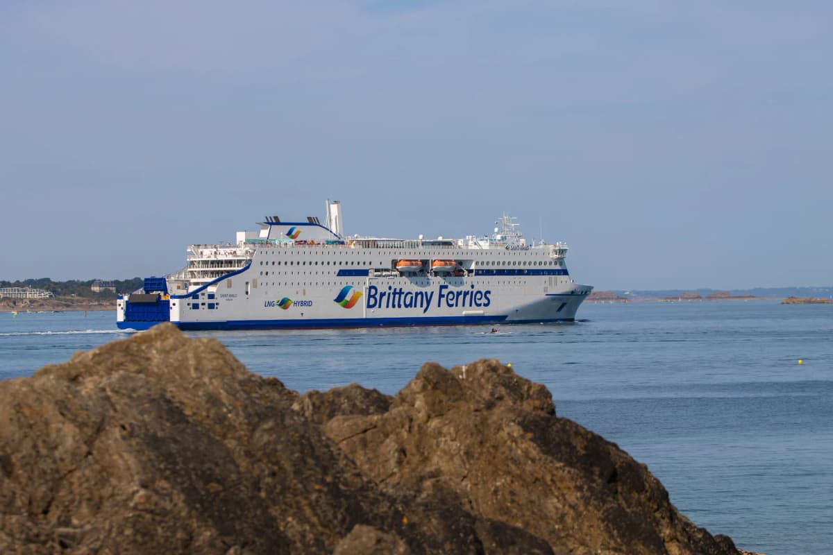 Brittany Ferries vessel cruising near the coast of Saint-Malo, capturing a tranquil maritime scene.